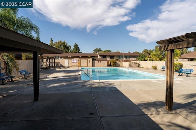 view of pool featuring a patio