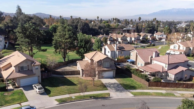 birds eye view of property featuring a mountain view