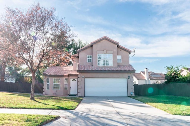 view of front of home featuring a garage and a front yard