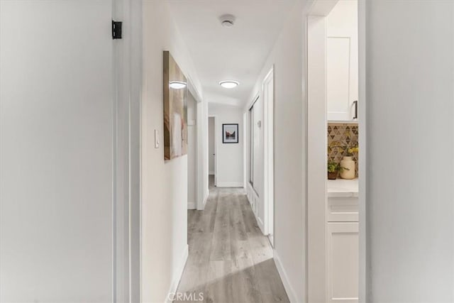 corridor featuring light hardwood / wood-style flooring