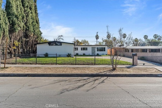 ranch-style home with a front yard