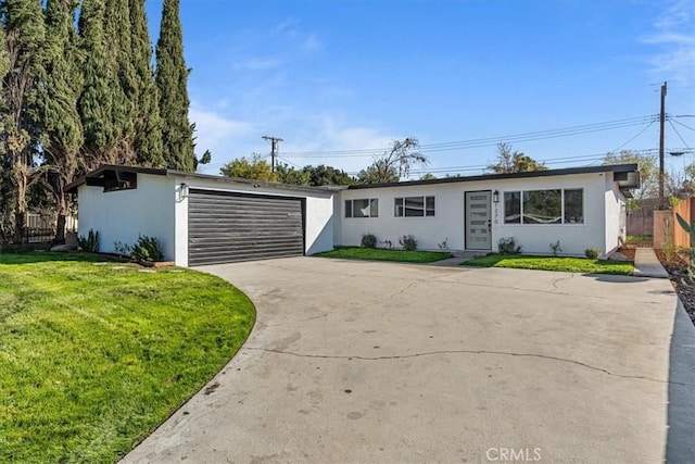 ranch-style home with a front yard and a garage