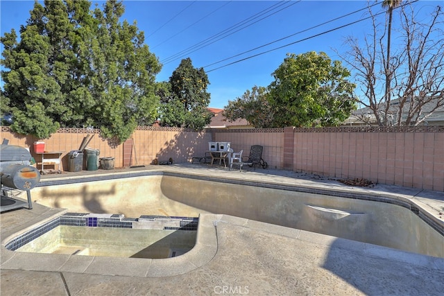 view of pool featuring a patio