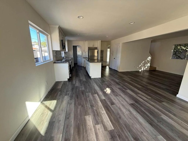 interior space with dark hardwood / wood-style floors and sink