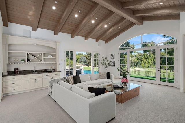 living room featuring french doors, high vaulted ceiling, a healthy amount of sunlight, and wood ceiling