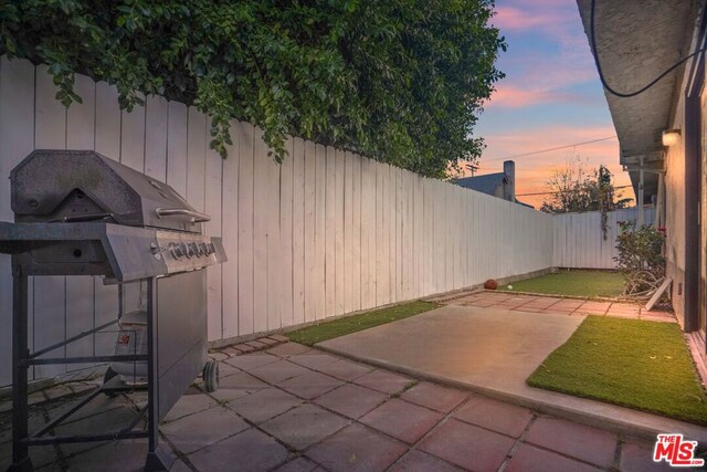 view of patio terrace at dusk