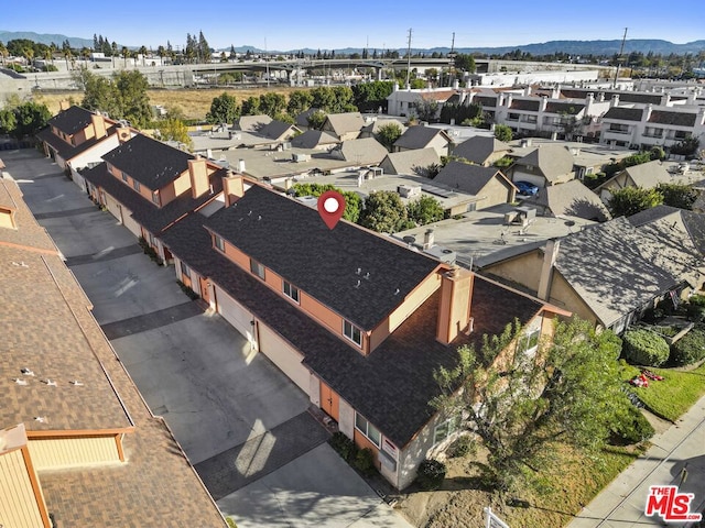 drone / aerial view featuring a mountain view