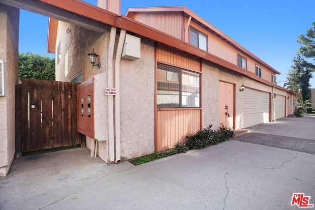 view of side of property with a garage