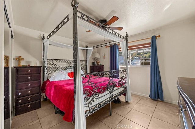 tiled bedroom with ceiling fan