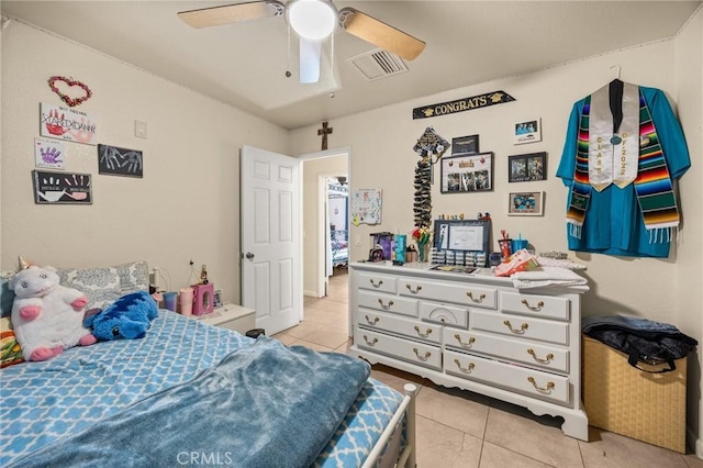 bedroom with ceiling fan and light tile patterned flooring