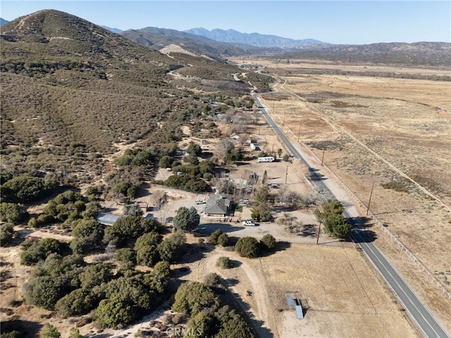 birds eye view of property featuring a mountain view