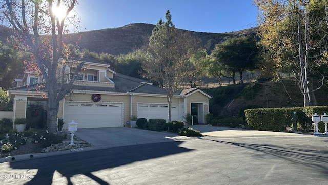 exterior space featuring a mountain view and a garage