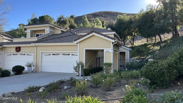 view of front of home featuring a mountain view and a garage