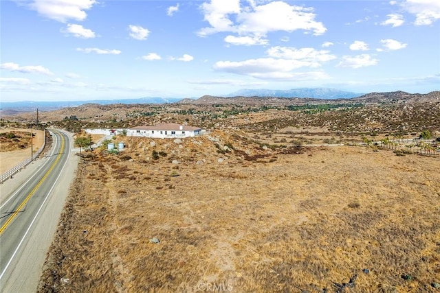 birds eye view of property featuring a mountain view