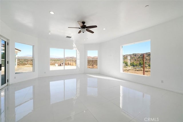 empty room with recessed lighting, visible vents, and ceiling fan