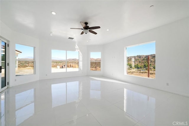 unfurnished room featuring recessed lighting, visible vents, tile patterned flooring, and ceiling fan
