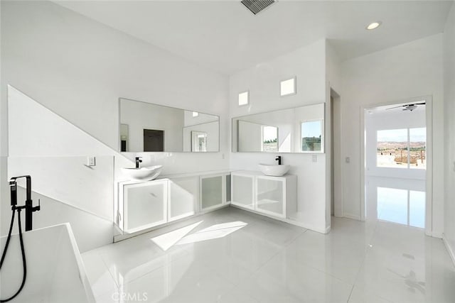 bathroom with tile patterned floors, vanity, baseboards, visible vents, and recessed lighting