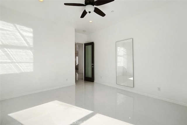 unfurnished room with recessed lighting, tile patterned floors, baseboards, and a ceiling fan