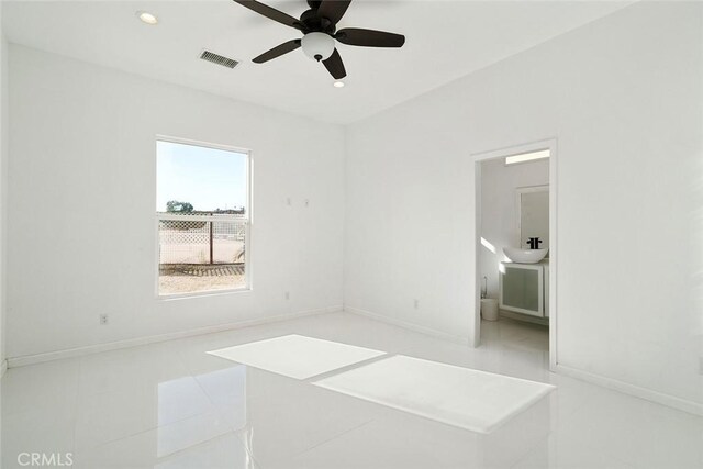 unfurnished bedroom featuring recessed lighting, tile patterned floors, visible vents, a ceiling fan, and baseboards