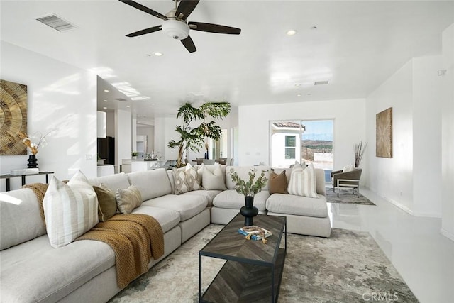 living area featuring recessed lighting, visible vents, and ceiling fan