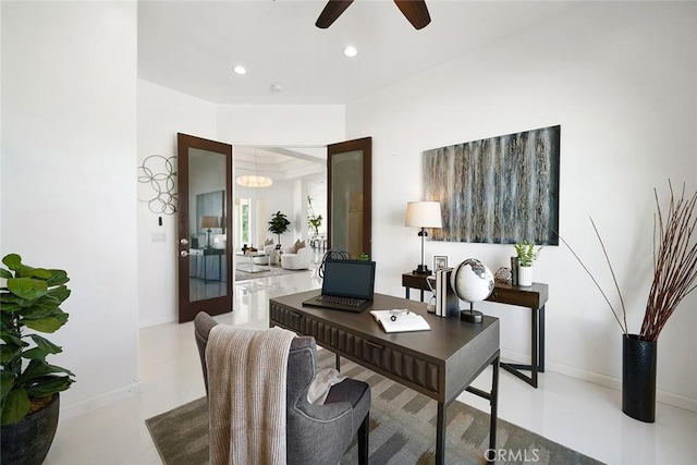 office area with recessed lighting, baseboards, concrete flooring, and ceiling fan with notable chandelier