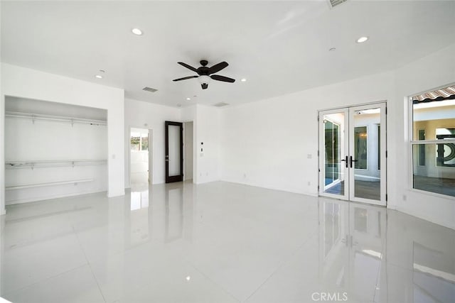 unfurnished bedroom with tile patterned flooring, french doors, visible vents, and recessed lighting
