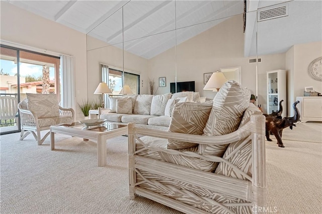 living room with carpet flooring, beam ceiling, and high vaulted ceiling