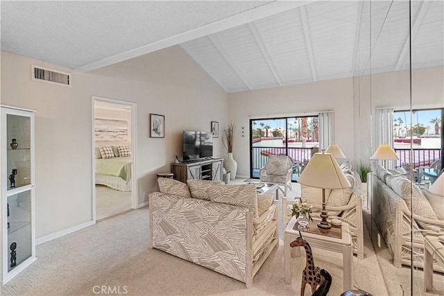 carpeted living room featuring high vaulted ceiling and beamed ceiling