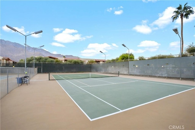 view of tennis court with a mountain view and basketball court