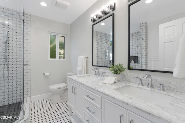 bathroom featuring toilet, walk in shower, and vanity