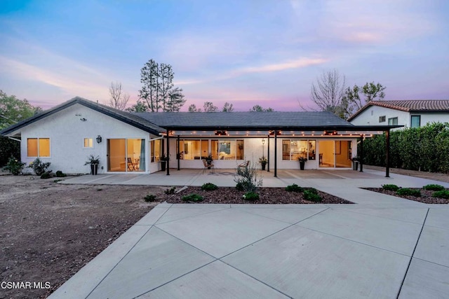 view of front of property with solar panels