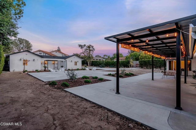 view of patio terrace at dusk