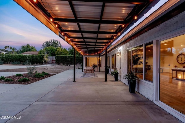 view of patio terrace at dusk