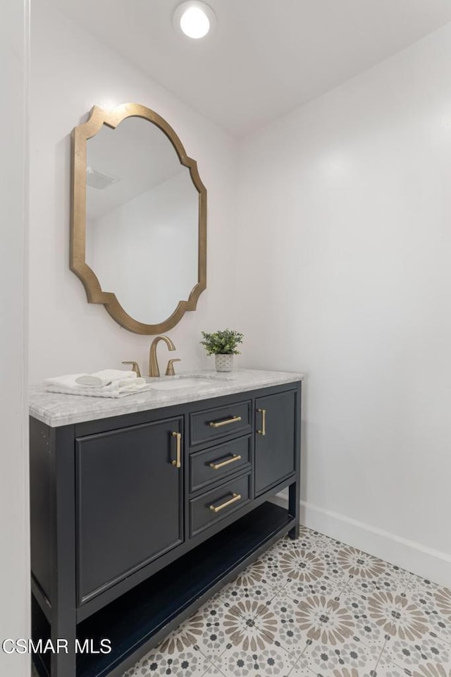 bathroom featuring tile patterned floors and vanity