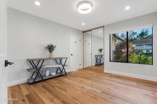 unfurnished room with light hardwood / wood-style floors