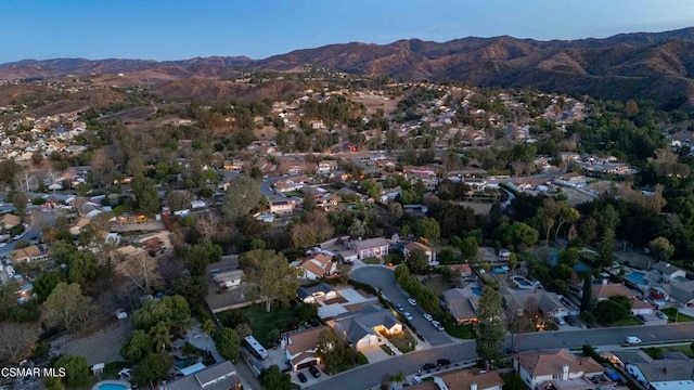 drone / aerial view featuring a mountain view