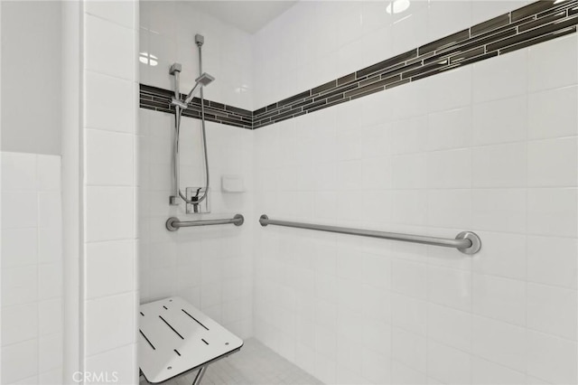 bathroom with tiled shower