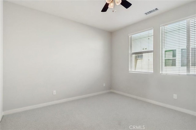 carpeted empty room with ceiling fan