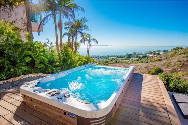 view of pool with a water view