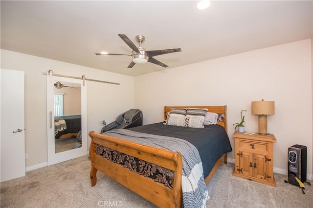 bedroom featuring ceiling fan and light carpet