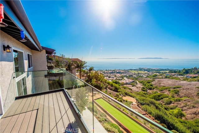 balcony featuring a water view