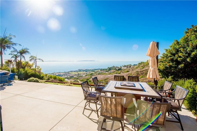 view of patio featuring a water view