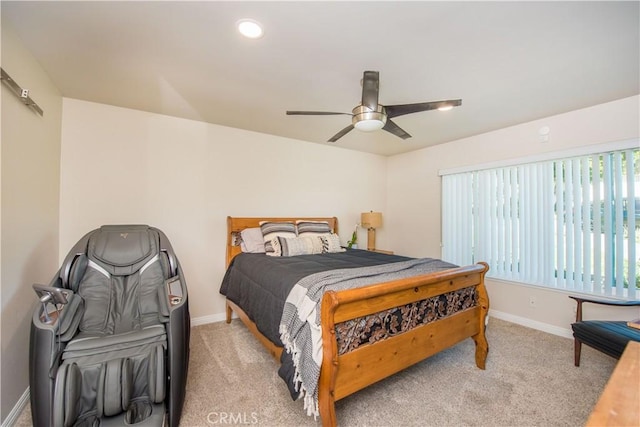 bedroom featuring ceiling fan and light carpet