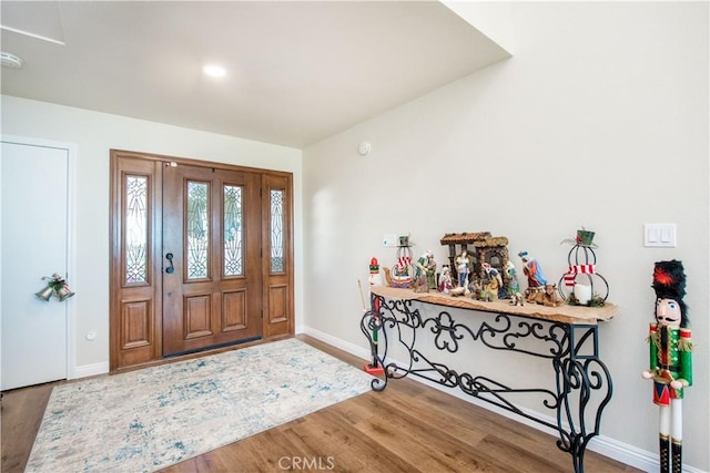 entryway with hardwood / wood-style floors and indoor bar