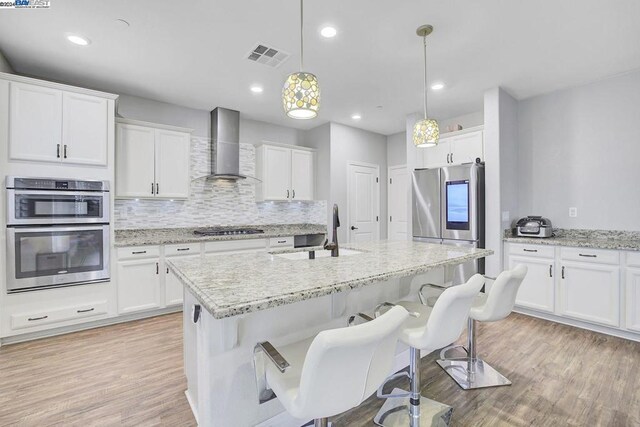 dining room with light hardwood / wood-style flooring and sink