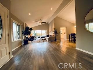 living room featuring ceiling fan, vaulted ceiling, and dark hardwood / wood-style flooring