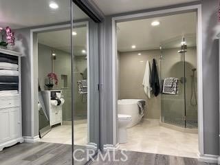 bathroom featuring toilet and hardwood / wood-style flooring