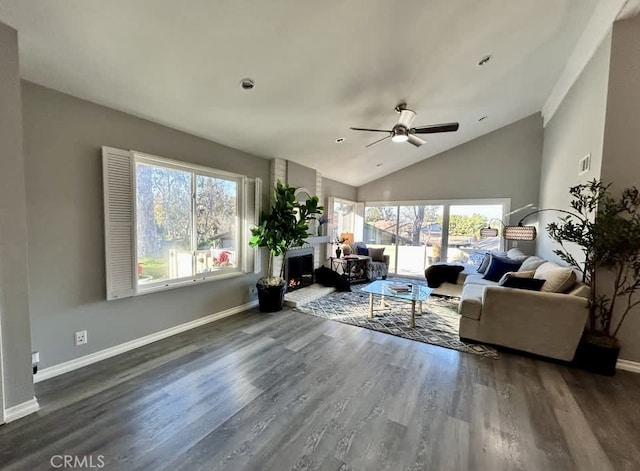 living room with ceiling fan, wood-type flooring, and high vaulted ceiling