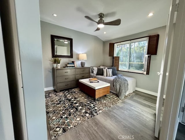 bedroom with vaulted ceiling, dark wood-type flooring, and ceiling fan