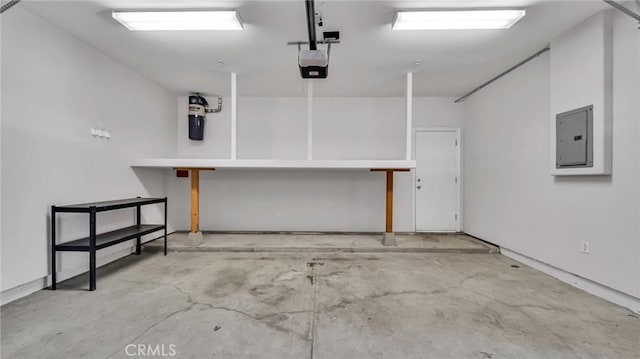 garage featuring electric panel and a garage door opener